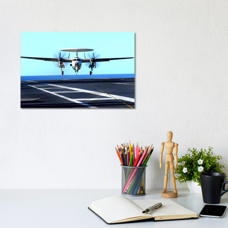 An E-2C Hawkeye Approaches For Landing Aboard USS John C. Stennis by Stocktrek Images - Wrapped Canvas Print