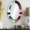 Arbres abstraits rouges et noirs au bord du lac - miroir mural ovale traditionnel jaune