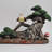 Laursen Lying Down with Owl Statue