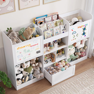 Étagère Montessori à 3 niveaux (189 cm de large) avec 2 grands compartiments pour peluches, 2 tableaux à dessin magnétiques, un tiroir amovible et 3 casiers. Idéale pour la chambre d'enfant, la salle de jeux ou la crèche. Couleur : blanc.