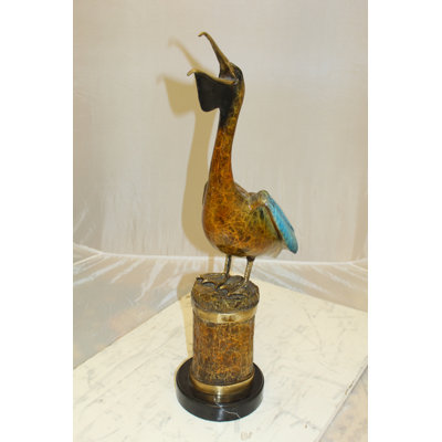 Blouin Pelican on a Tree Stump Bronze Statue -  Size: 8"L x 12"W x 27"H.