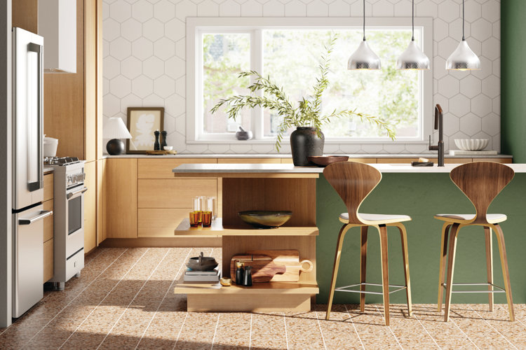 modern kitchen with a green island, wood counter-height stools, and a vase full of trimmed greenery