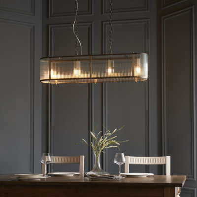 Anesty 4lt Linear Pendant light finished in Ant. Brass