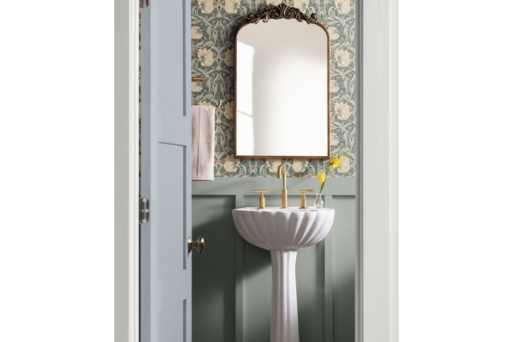 statement mirror over a beautiful pedestal sink