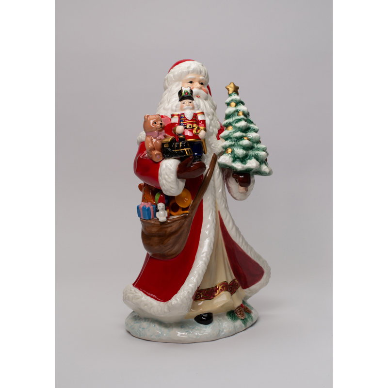 Figurine de père Noël tenant des jouets