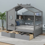 A Wooden House Bed With Two Drawers, Designed As A Kids' Bed Featuring A Storage Shelf