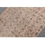 Le tapis traditionnel turc beige ajoute un charme rustique à votre espace de vie intérieur ou extérieur
