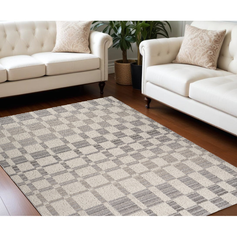 Tapis gris et beige à carreaux délavé