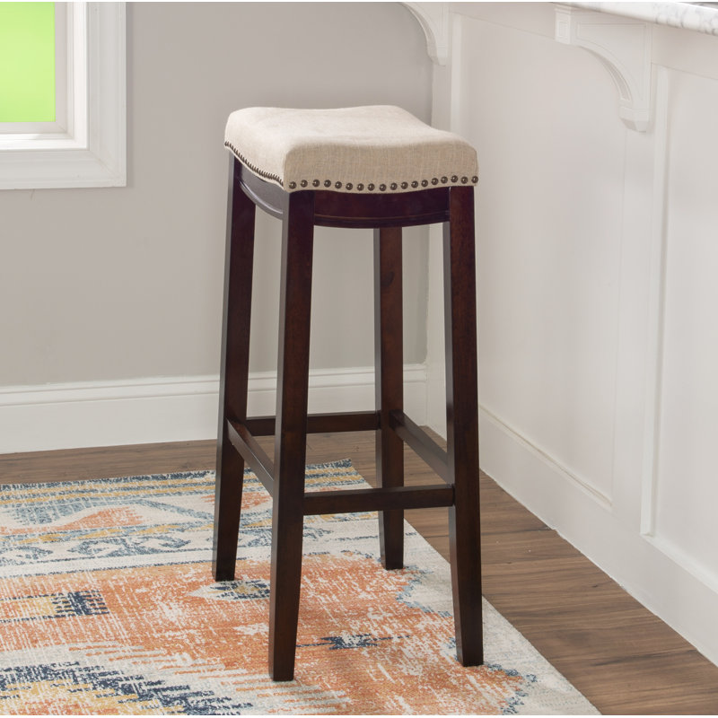 Tabouret de comptoir et de bar en bois massif sans dossier avec siège rembourré Bartonville, Beige lin / Noyer foncé