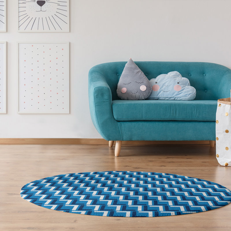 Tapis rond bleu à motif géométrique