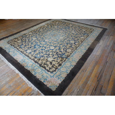 Tapis chinois antique à motif floral noué à la main des années 1920