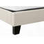 Structure de lit grand format avec pieds en bois noir, aspect lin beige, pas de sommier tapissier, fabrication robuste