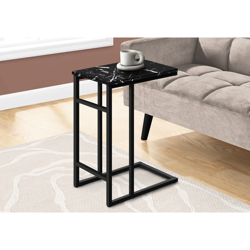 Table de bout élégante avec surface en marbre noir et cadre latéral en métal massif, salon