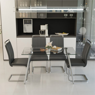 Table de salle à manger rectangulaire en verre pour 4 personnes avec plateau en verre trempé et pieds en acier argenté, design minimaliste moderne pour la cuisine ou le bureau