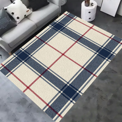 Tapis en velours doux et moelleux à carreaux rouges et bleu marine, idéal pour le salon ou la chambre. Antidérapant et lavable, il offre un style minimaliste et chic. Dimensions : 100 x 160 cm.
