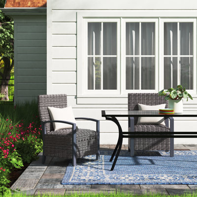 Adasha Wicker Premium All-Weather Wicker Outdoor Dining Armchair with Sunbrella® Cushion