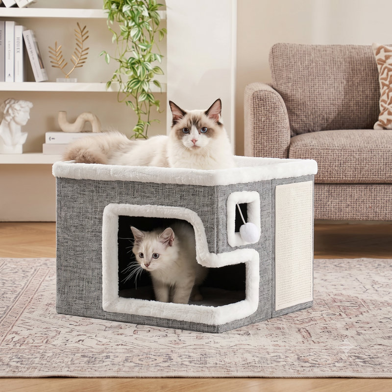 Spacieux et pliable, ce refuge pour chats est un véritable havre de paix. Son design moderne et fermé, inspiré des grottes, comprend une surface à griffer et une balle de jeu en peluche. Convient aux gros chats et aux chatons. Dimensions : 42 x 42 x 33 cm. Couleur : Gris clair.