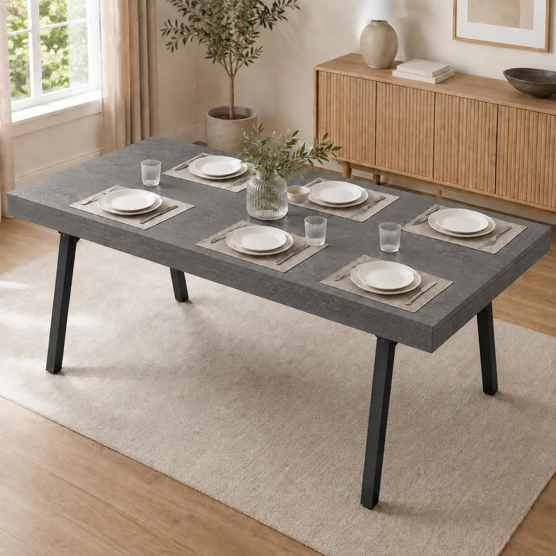 Table de salle à manger moderne rectangulaire grise aux bords arrondis, idéale pour les repas en famille et au quotidien.