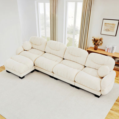 Canapé modulaire en L à 4 places avec repose-pieds et coussins décoratifs