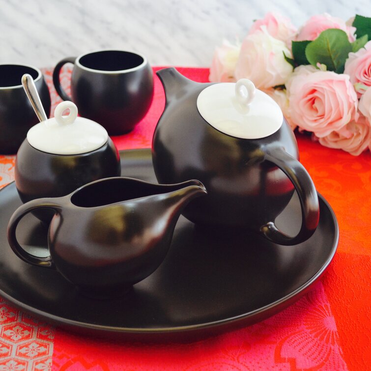 Eva tea set: Modern teapot, tea cups, creamer, sugar bowl, serving