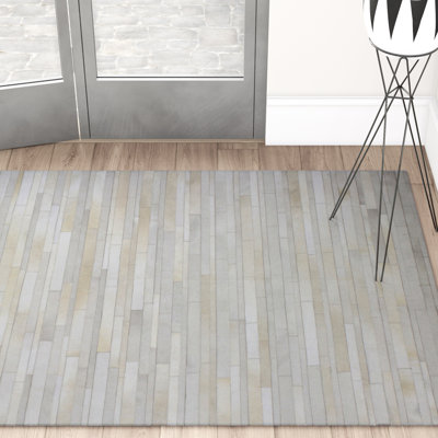 Zehner Cowhide Striped Indoor Rug