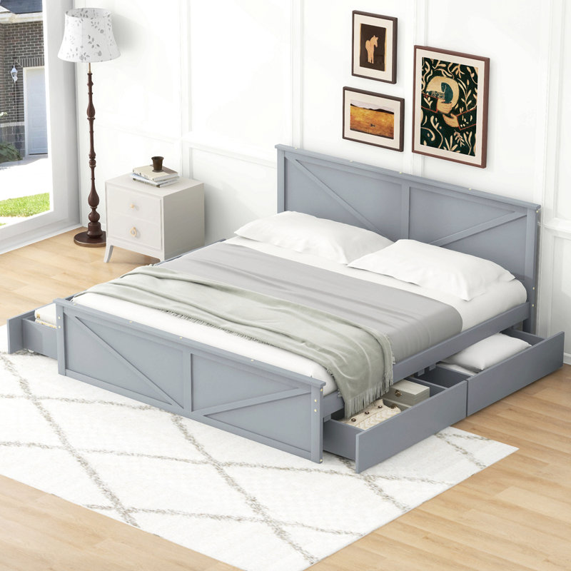 Lit plateforme en bois avec quatre tiroirs de rangement et pieds de soutien