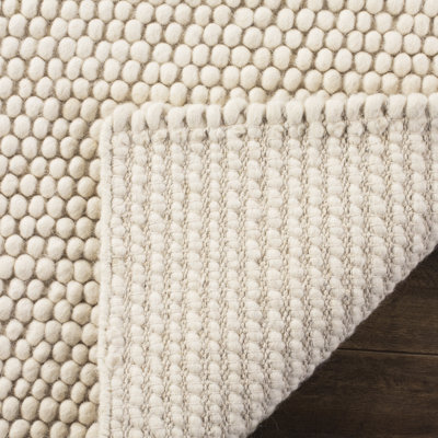 Natura Solid Color Area Rug In Ivory