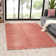 Solid Color Machine Woven Polypropylene Area Rug in Pink
