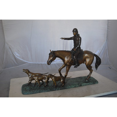 Perna Hunter with three dogs Bronze Statue -  Size: 27"L x 6"W x 18"H.
