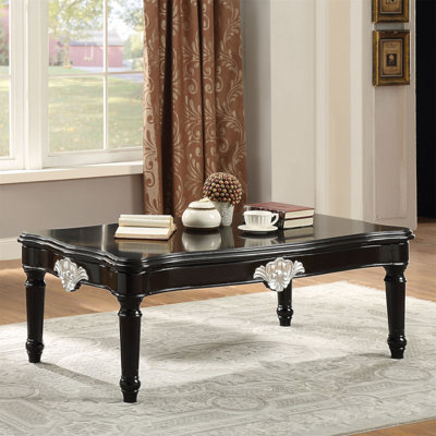 Table basse noire avec pieds tournés