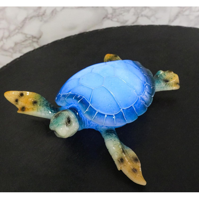 Figurine de tortue de mer géante et colorée à DEL