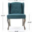 Fauteuil à oreilles avec dossier en tissu bleu sarcelle et boutons cloutés