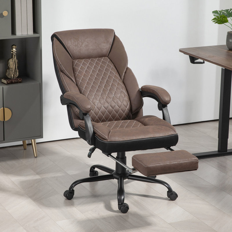 Fauteuil brun foncé ergonomique avec repose-pieds réglable en hauteur et inclinable pour les longues séances de travail