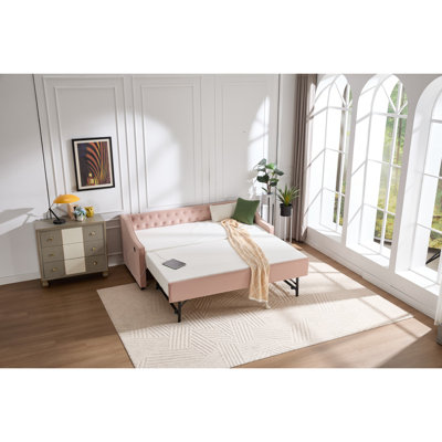 Lit de jour simple rembourré avec lit gigogne, port USB, poches latérales, lit de jour en velours avec bouton sur le dos et passepoil sur les accoudoirs ondulés pour la chambre d'amis