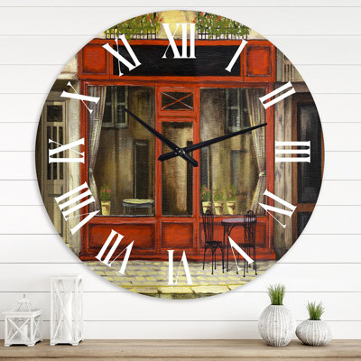 Horloge murale de la façade rouge de la boutique de charme Paris I - campagne française