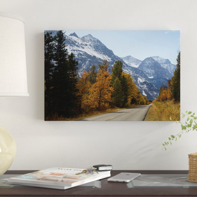 " Trees Along A Road With Mountain Range In The Background, Glacier National Park, Montana, USA " Color Photography
