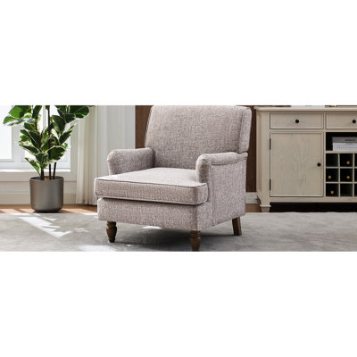 Fauteuil crème rétro avec revêtement en lin et pieds tournés en bois d'hévéa antique, pour lire un magazine dans un livre rembourré confortable