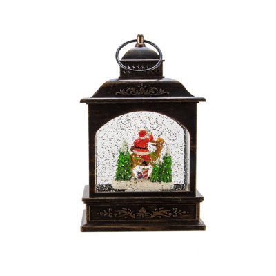 Kurt Adler Battery Operated LED Santa Lantern with Twirling Snow Motion, 9in