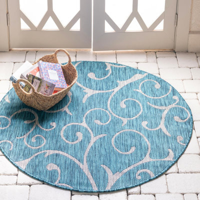 Teal Floral Machine Woven Polypropylene Indoor / Outdoor Area Rug in Teal