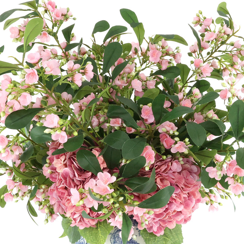 Hortensias et tiges en herbe dans un vase décoratif, Rose