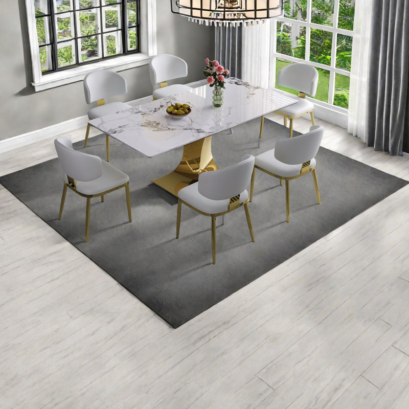 Ensemble de table de salle à manger moderne avec base plaquée or, surface en pierre frittée, idéal pour la cuisine à domicile