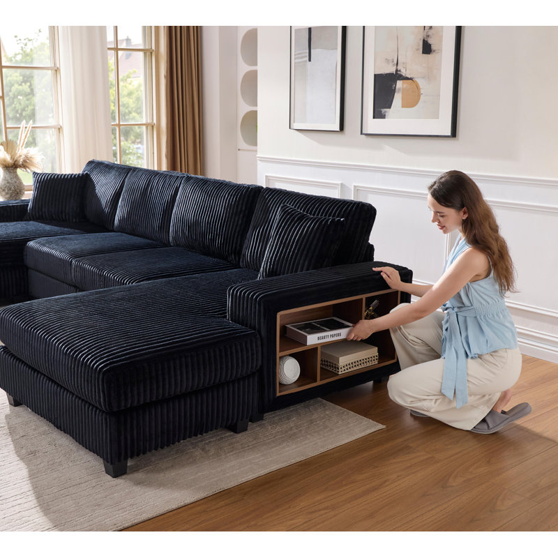 Canapé convertible en forme de U avec tissu velours côtelé, offrant confort moderne et fonctionnalité pour la détente du salon