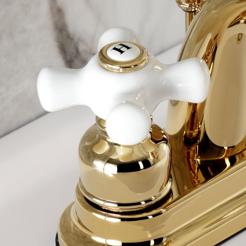 Robinet de salle de bain central à fixation à deux poignées à 3 trous à fixation sur le comptoir 4 po Kingston, Laiton poli