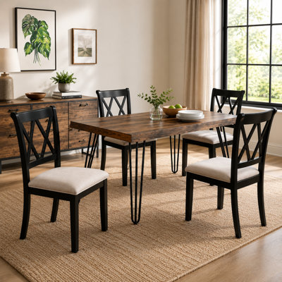 A Five-Piece Set Of Dark Black Dining Table And Chairs, Including A Hairpin-Style Dining Table And Four Cross-Back Dining Chairs. A Complete Home Dining Table And Chair Set.