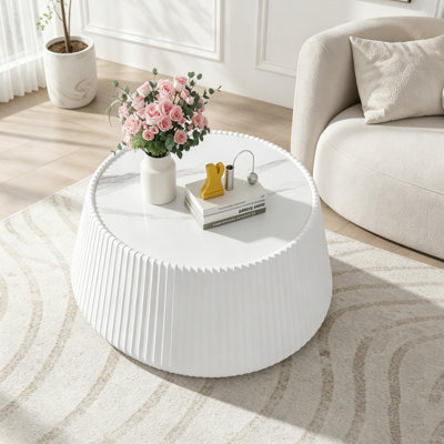 Table basse ronde avec dessus en pierre frittée et corps en cuir