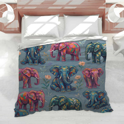 Édredon coloré avec éléphants et fleurs