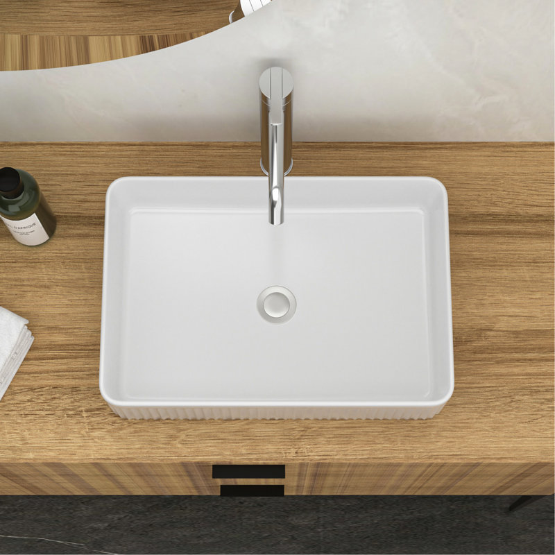 Lavabo moderne en céramique blanche rectangulaire, résistant aux taches, polyvalent et élégant pour les salles de bain à domicile.