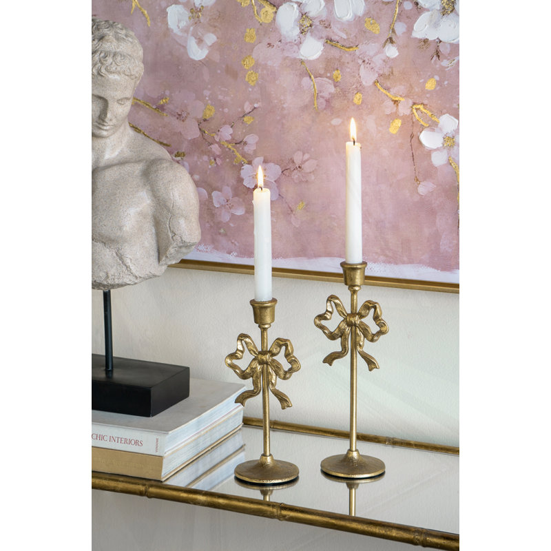 S/2 Gold Cast Iron Candle Holders With Playful Bow Design