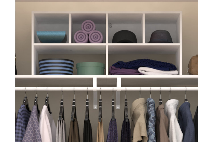 Close-up of the shelf above a closet clothing rack, which has a cubby shelving unit with six cubby slots.
