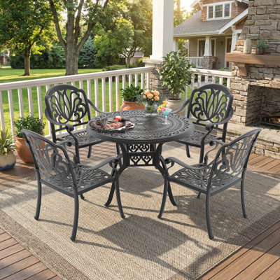 Andaiye 4 - Person Patio Dining Set with Round Table , Brown Cushions Included